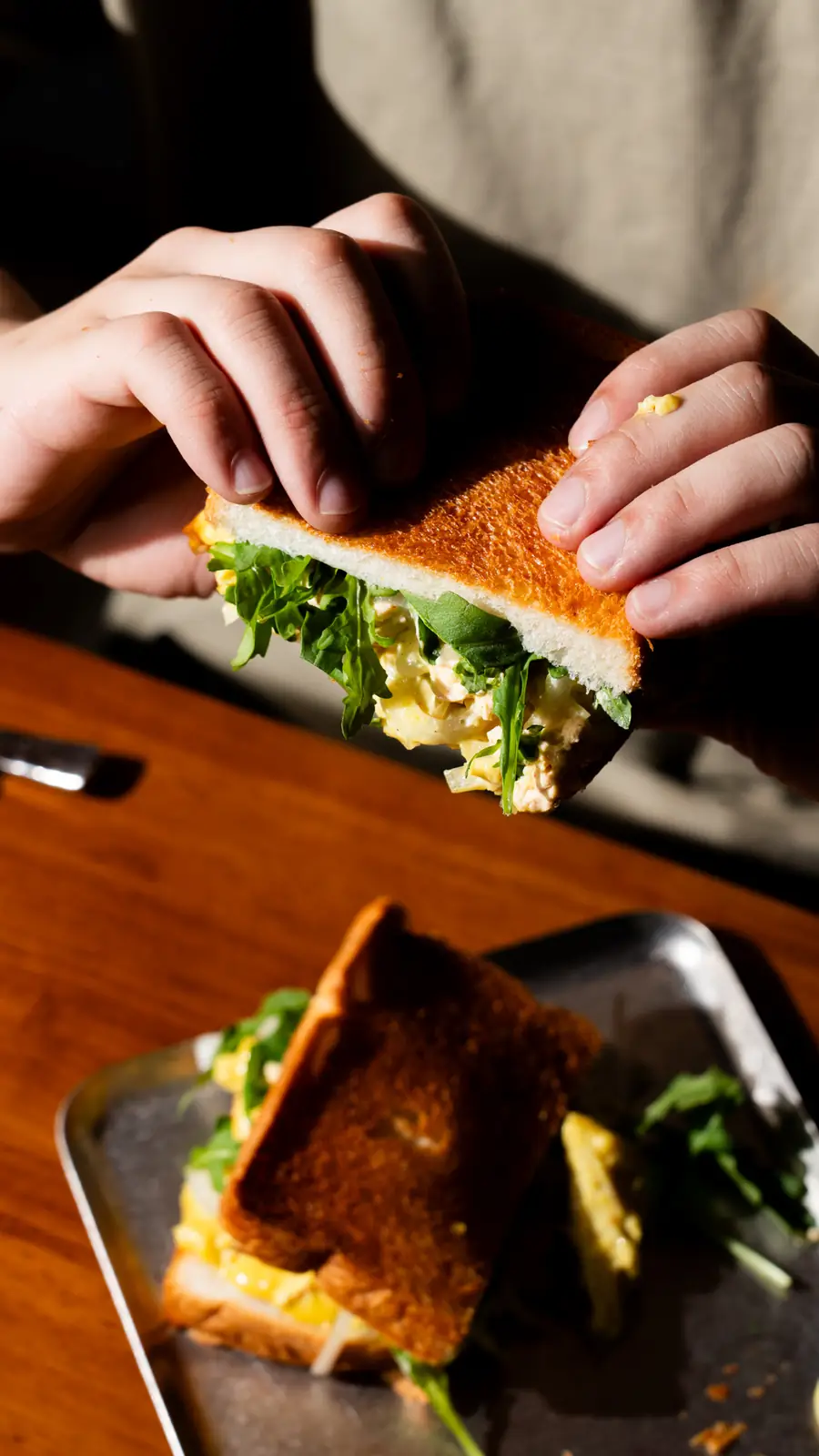 Man eating toast at To;asta.